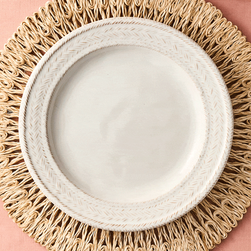 Moveable square gif featuring decorative plates with floral pattern on a woven placemat mix with whitewash plates