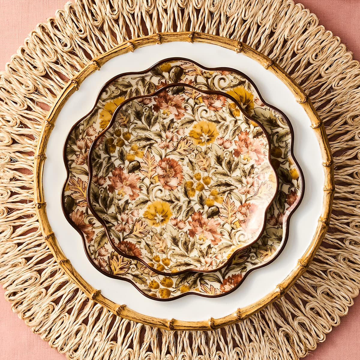 Decorative plate with floral pattern on a woven placemat