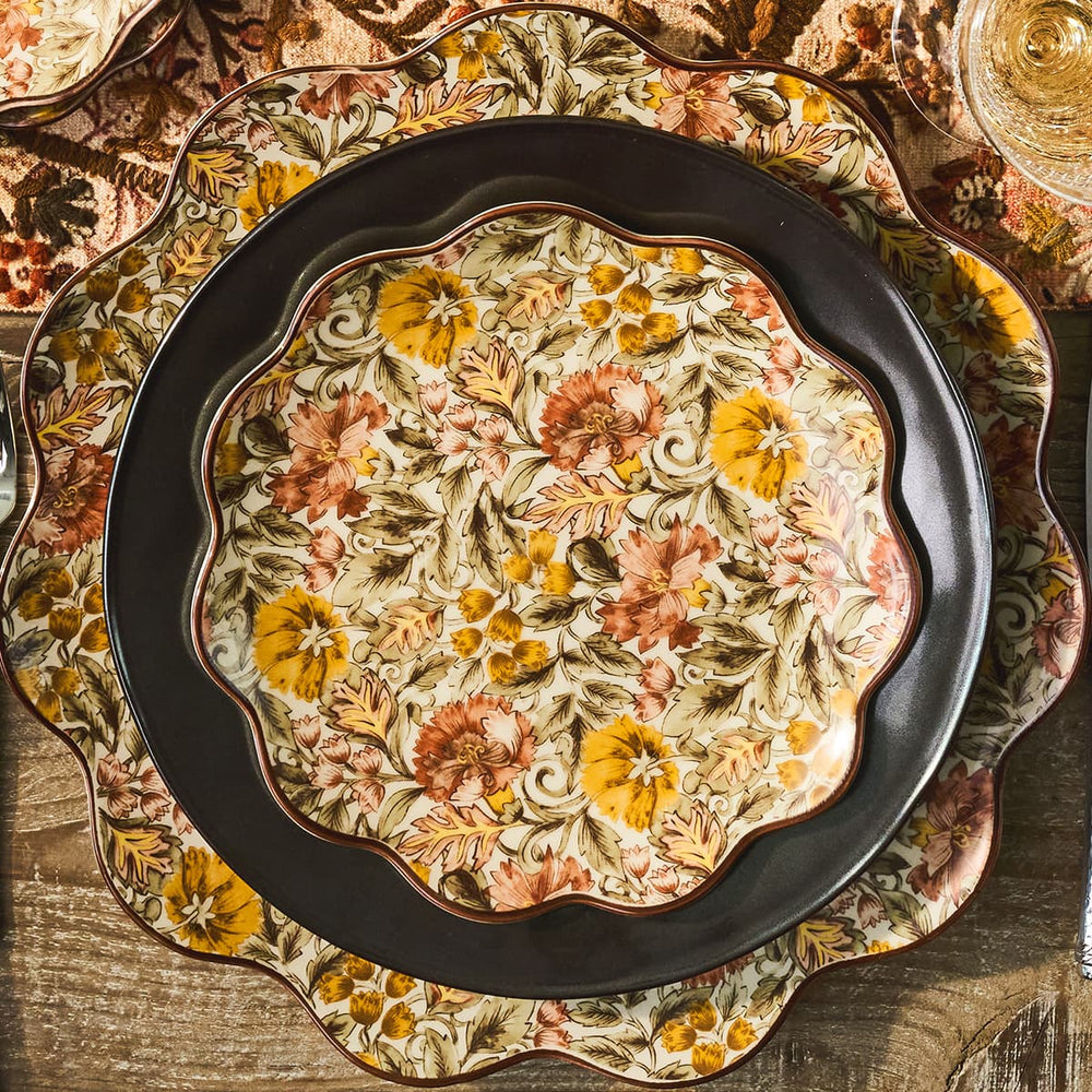 Decorative plate with floral patterns on a wooden surface