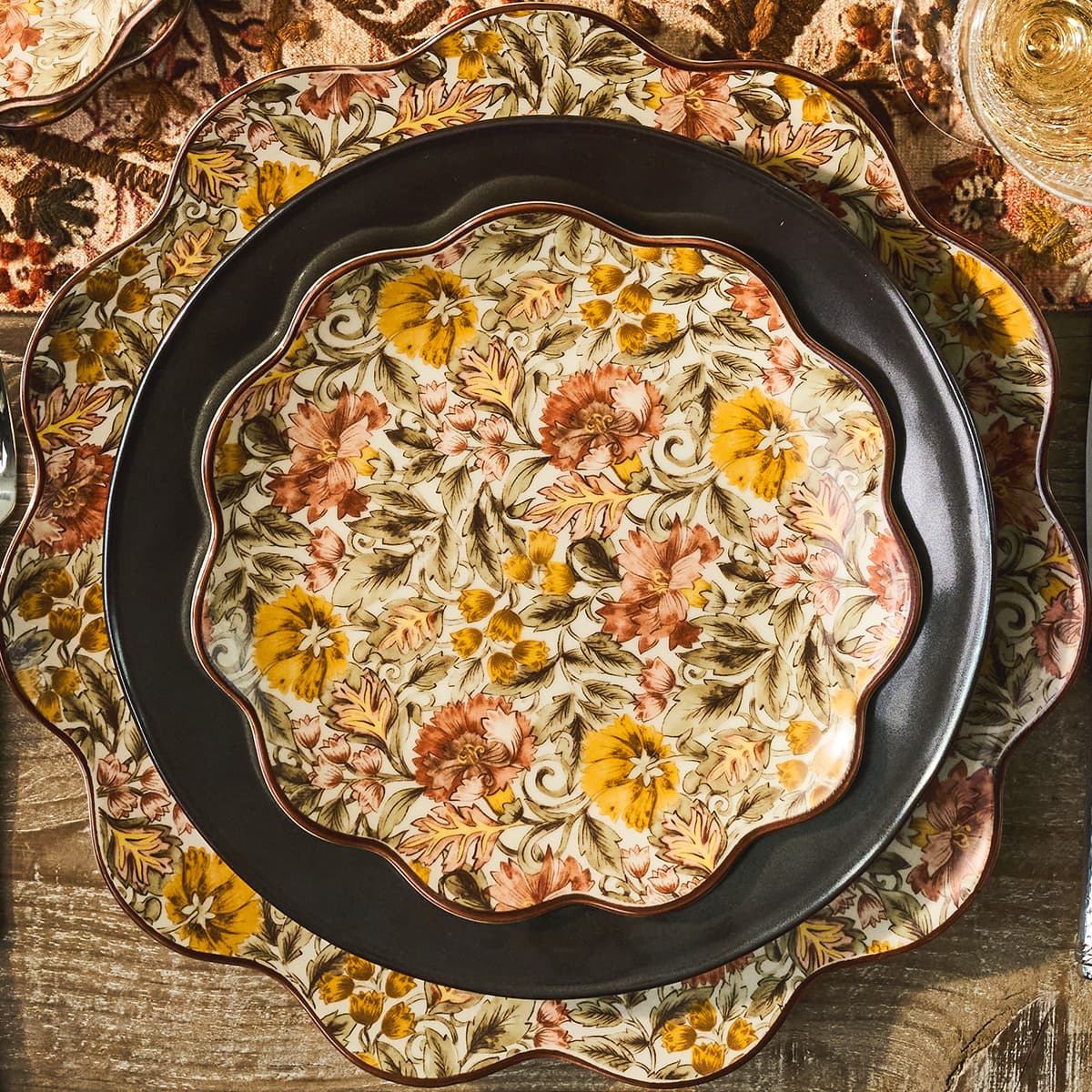 Decorative plate with floral patterns on a wooden surface