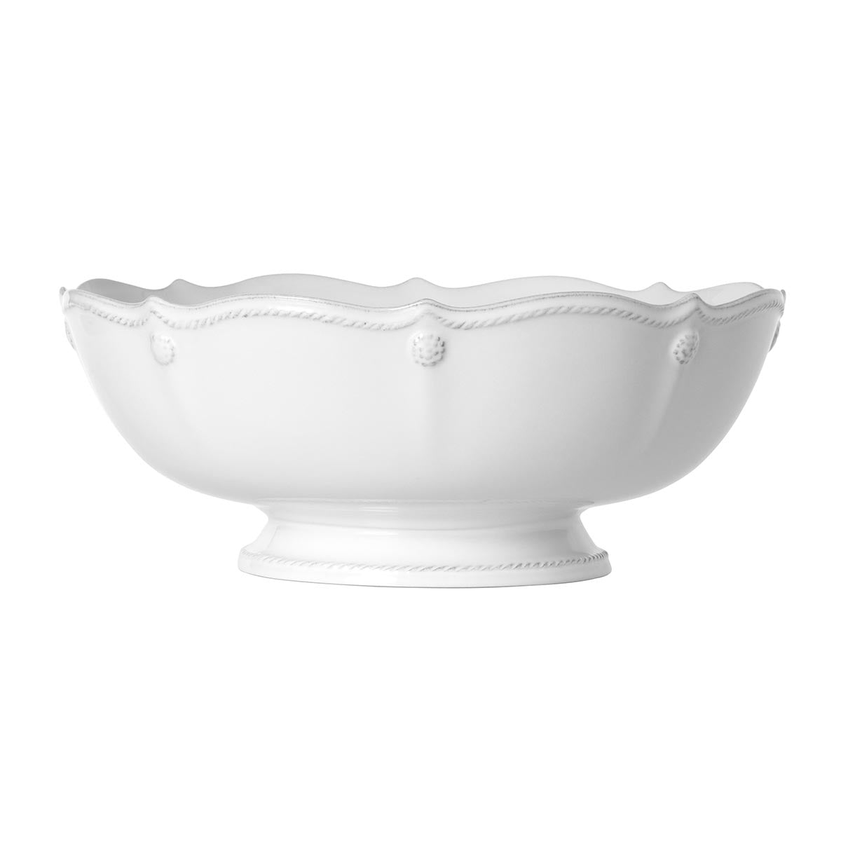 Whether used as a centerpiece or a serving piece, our footed fruit bowl makes the perfect statement. Timeless in white, its scalloped edge and signature berry and thread motif provide a subtle backdrop for the contents within.