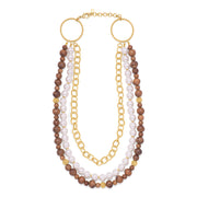 Three strand necklace of gold chain, mother of pearl, and teak.