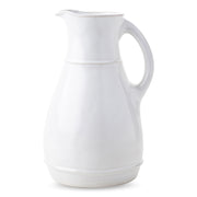 From fresh juices to a bundle of colorful blooms, this whitewash ceramic pitcher offers an organic texture that blends everyday elegance with practicality.