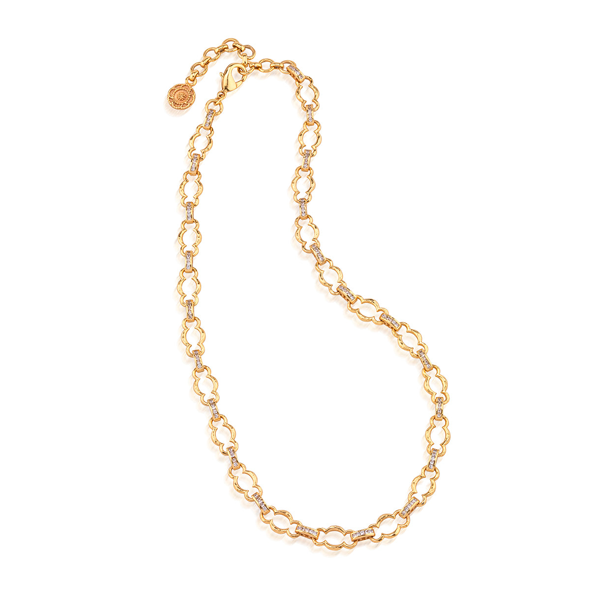 A gold chain necklace with elongated oval links and a small round charm, displayed on a clean white background.