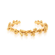 Meadow wildflowers and butterflies festoon a golden vine to compose this petite bracelet cuff that’s as elegant as it is enchanting. Look closely and discover gilded wings, curling leaves and polka-dotted ladybugs. Fabulous on its own or to enliven any bracelet stack with a touch of garden romance.