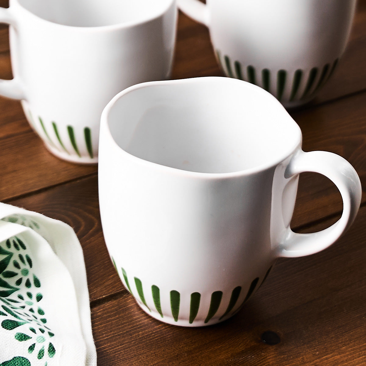 Stripe mug by Juliska, styled table setting view