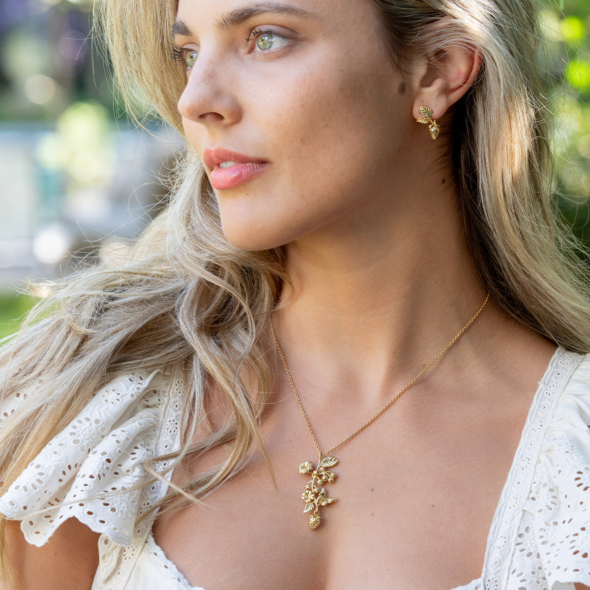 Meadow Walk Bouquet Charm Necklace 16in 2in Gold, styled table setting view