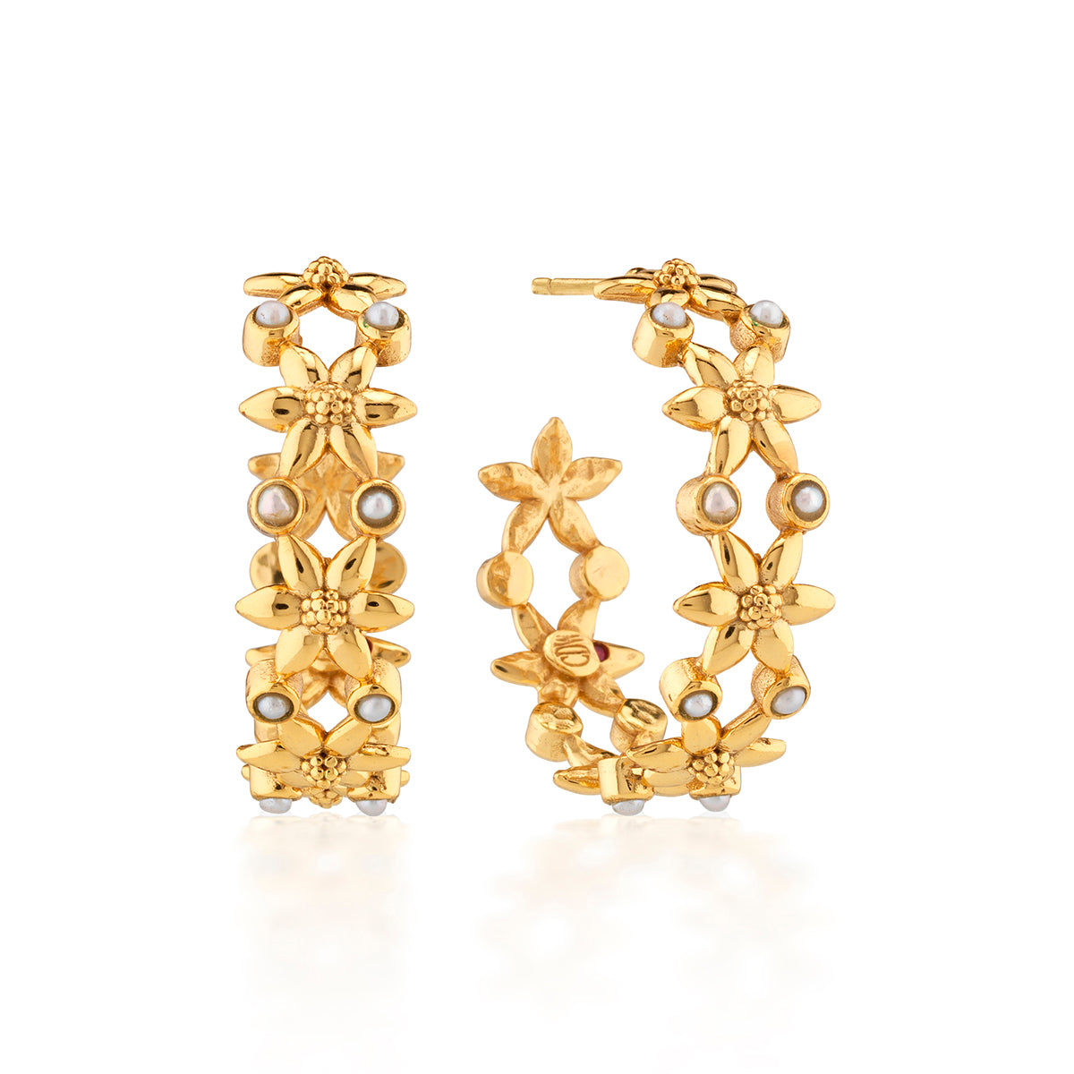 Classic gold hoop earrings are reimagined with tiny golden jasmine blossoms in intricate detail, embellished with a sprinkling of luminous seed pearls. This poetic pair is enchanting and elegant—the perfect versatile pick for weekends, workdays, getaways—and all the other days, too.