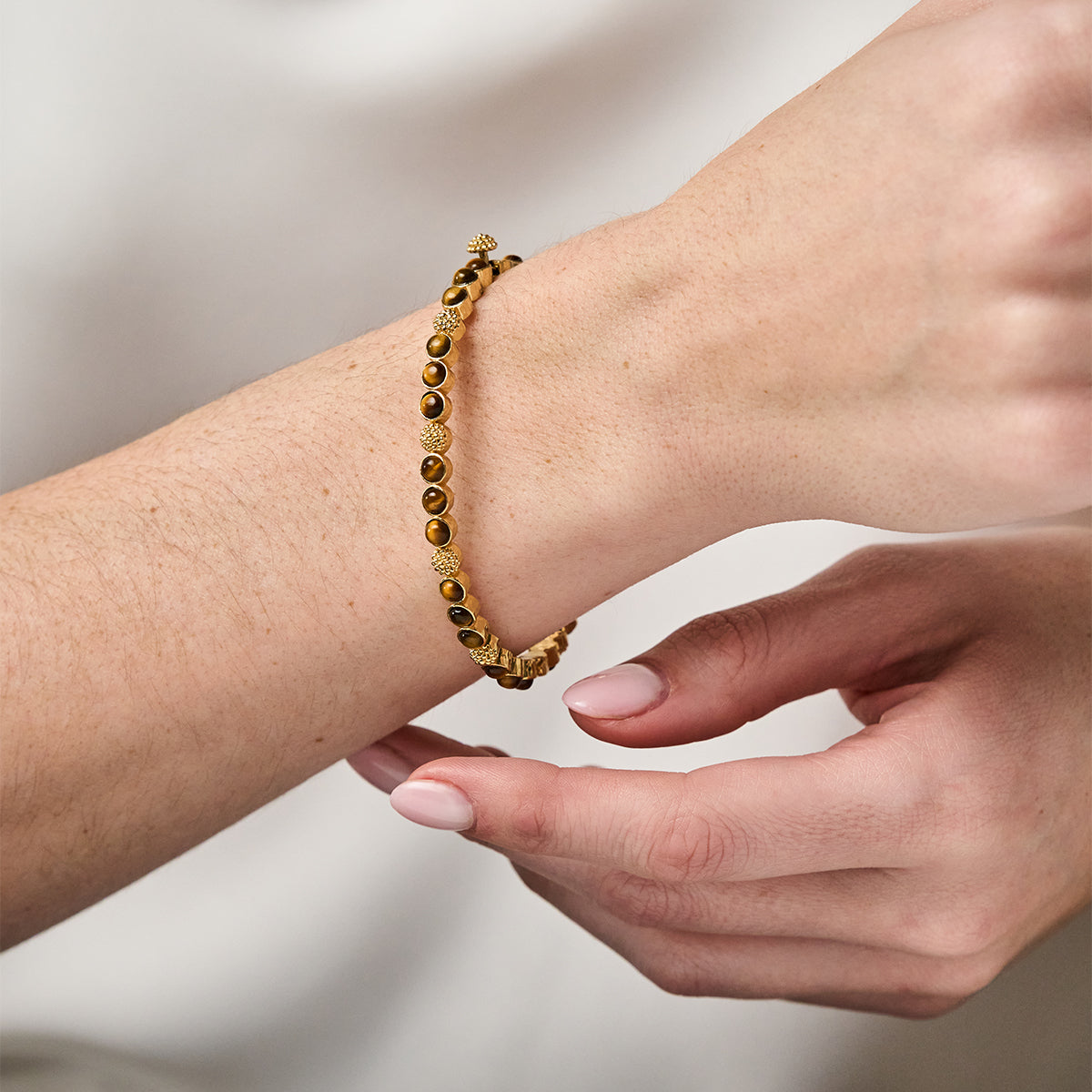 Berry Gem Petite Hinged Bangle - Tiger's Eye close up of bracelet on wrist