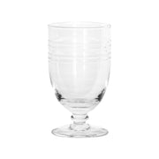 Everything looks better on a pedestal, and this gorgeous goblet is no excaption. Whether it’s filled with sparkling water or a vibrant party drink, this mouth-blown artisanal glass elevates everyday sipping to something a splash more special, with its endless rippling effect. Complete the look with its coordinating pitcher for easy and elegant entertaining.