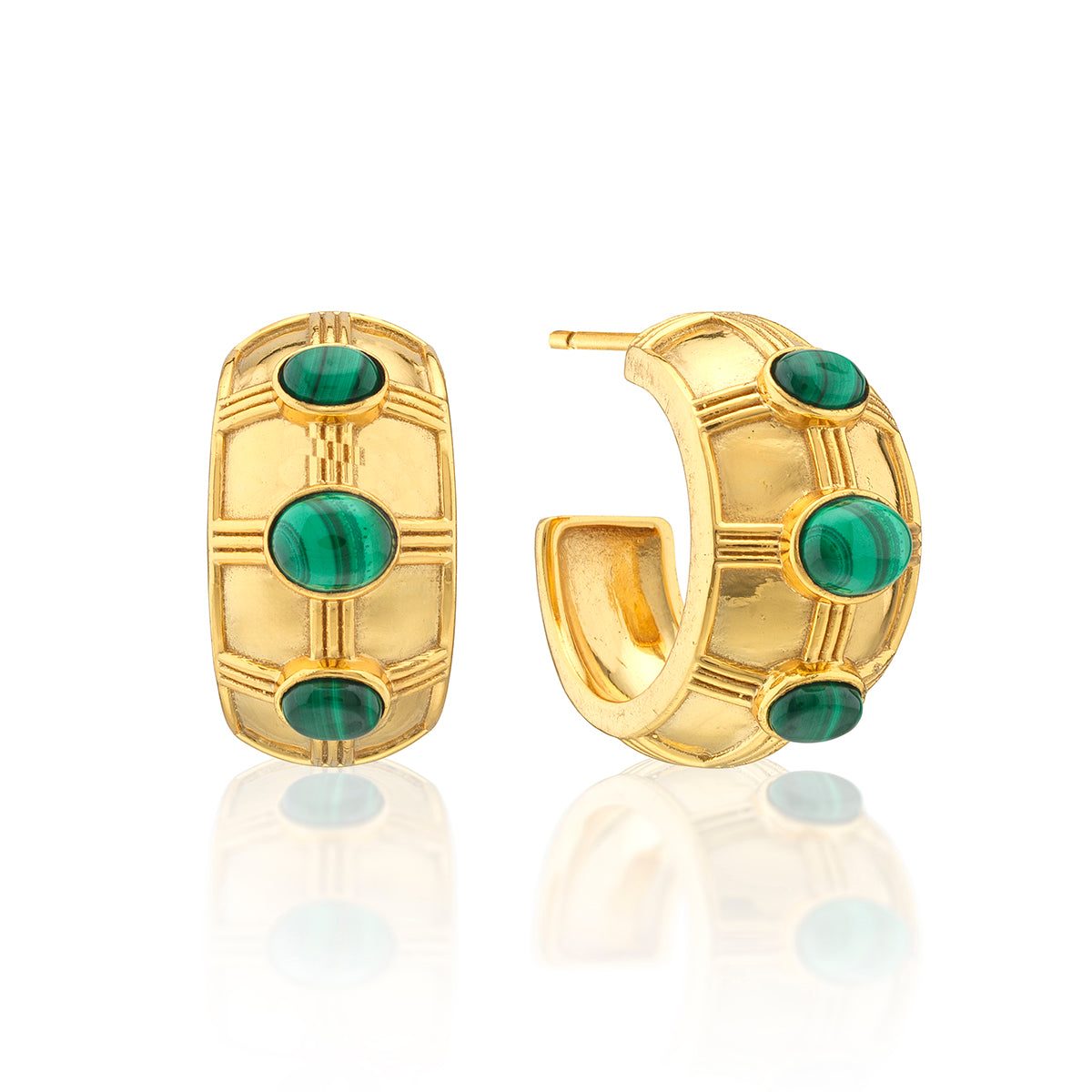 A pair of gold huggie hoop earrings with oval green malachite stone accents, displayed on a clean white background with a soft reflection below.