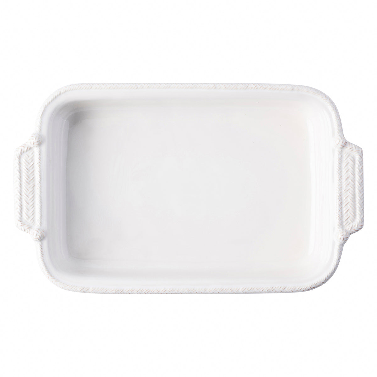 From our Le Panier Collection- The whitewash braided border on this large baking dish is reminiscent of nautical and equestrian traditions. The pair of pretty handles helps serve up rustic refinement in spades to pair with your legendary cherry lattice slab pie to treat a crowd. Our ceramic stoneware is made in Portugal and is dishwasher, freezer, microwave and oven safe.