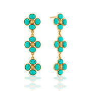 A trio of clovers descend in linear fashion for an effect that’s equally streamlined and romantic. Made with polished turquoise orbs and golden berry centers, this set brings femininity and a little luck to carry with you wherever you go.