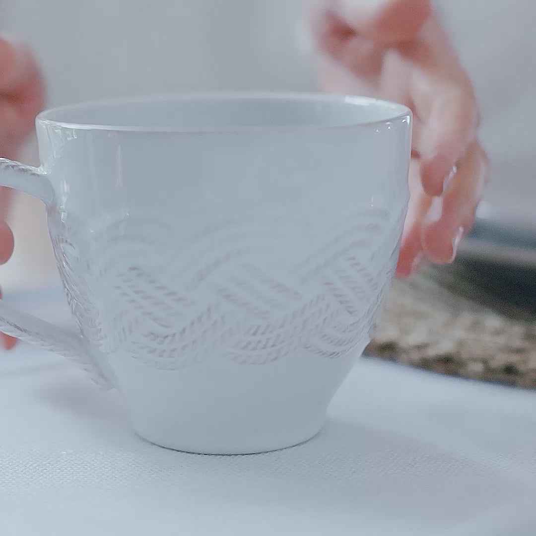 Load video: A video of the Juliska mystic knot ceramic collection amongst a table setting