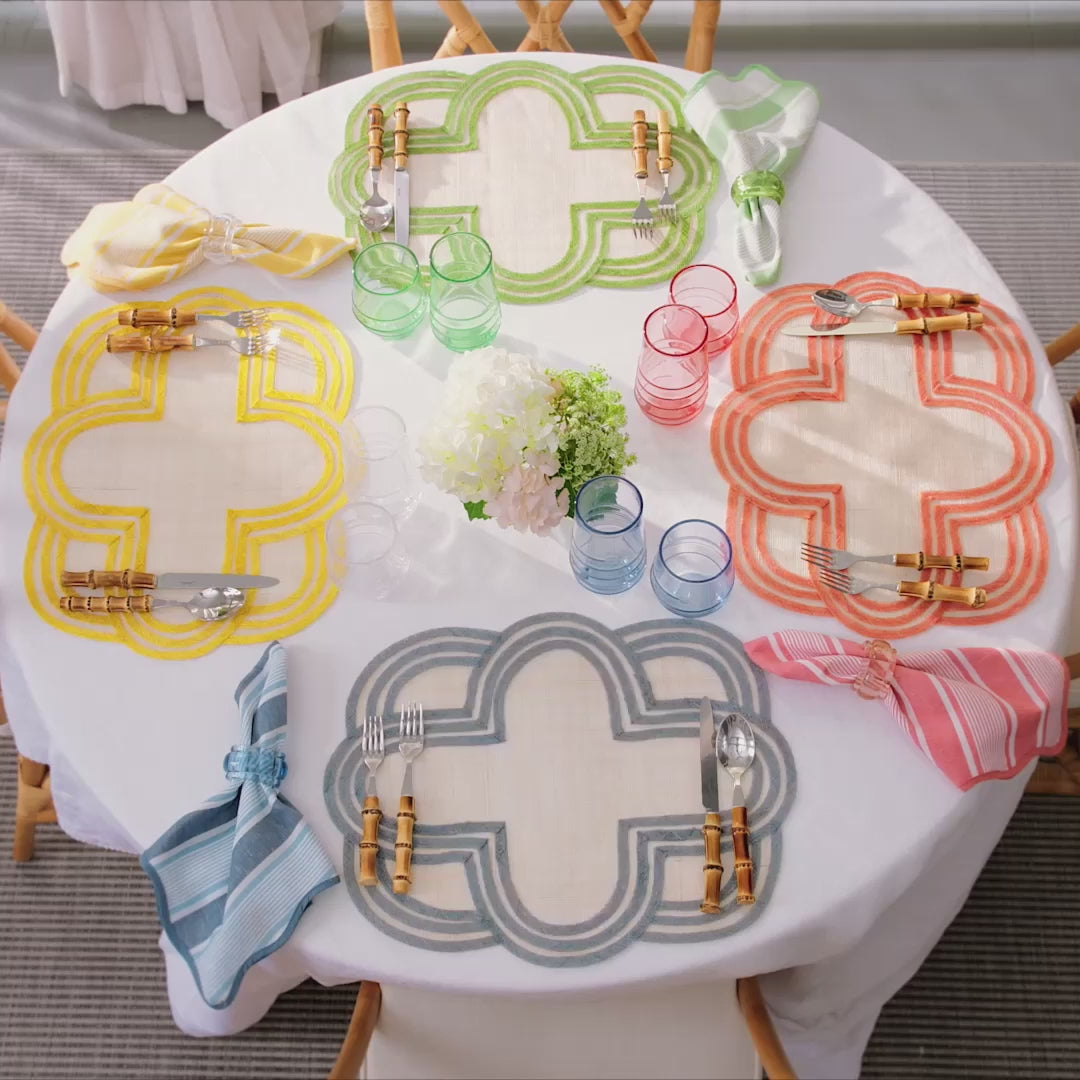 Load video: Video of blue, pink, green and yellow outdoor tablescape featuring Berry &amp; Thread melamine plates