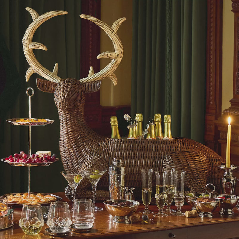 Moving gif featuring cocktail glasses, barware, and people cheering with cocktail glasses 