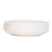 From our Bilbao Collection - Old-world patina meets modern silhouette with this large serving bowl that is the perfect vessel for serving up summer's fresh bounty of seafood, a hand-torn salad, or a handsome smattering of roasted potatoes. We also adore it as a mainstay fruit bowl on the countertop, or accent piece filled with found treasures from the seashore or forest floor. 