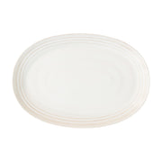 From our Bilbao Collection - Positively everything looks beautiful when served atop this generous hand-hewn platter, with its lustrous whitewash glaze that mixes and matches with any tablescape and occasion. Sophisticated and subtle, it works for everything from casual brunch to a formal dinner party. 
