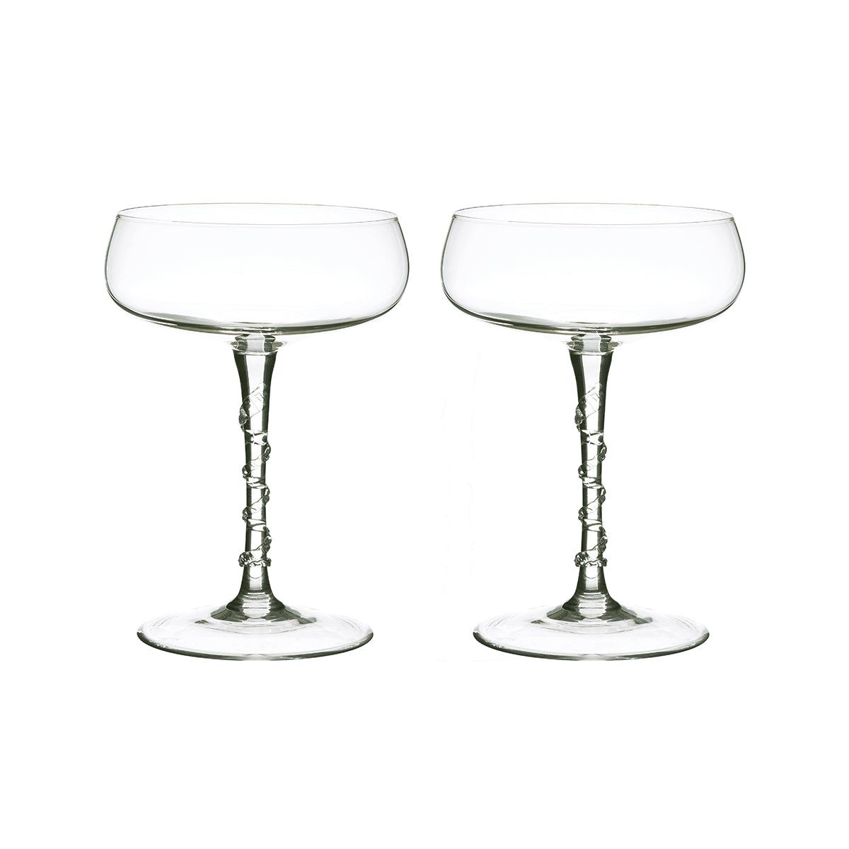 Two glasses cocktil coupes with bowls shaped like saucers and a swirled stem.