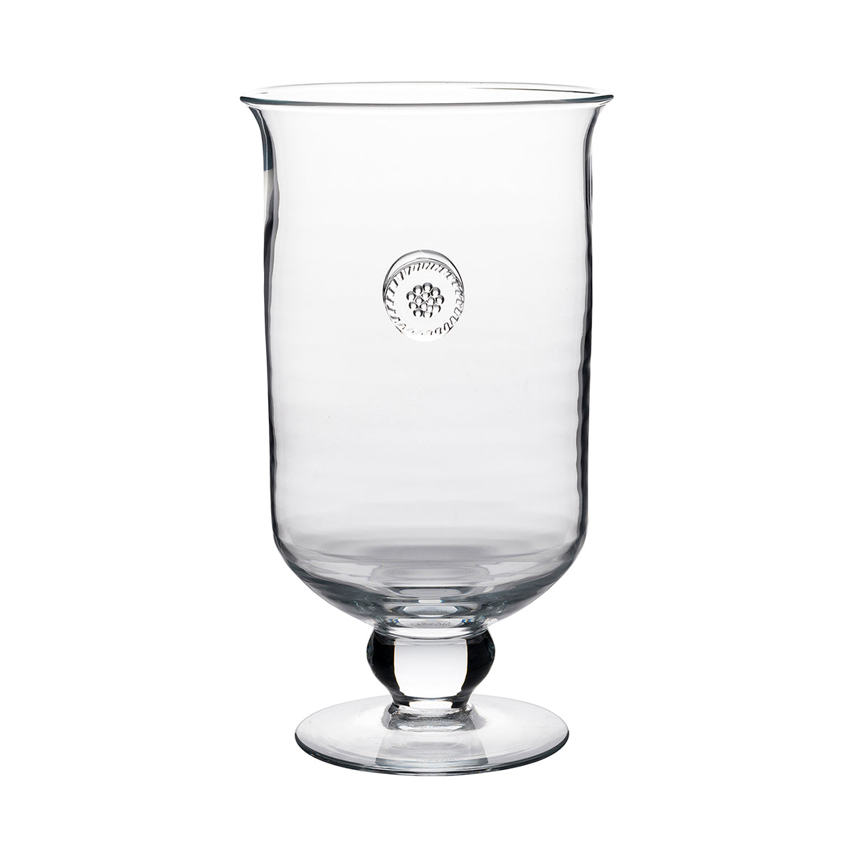From our Berry & Thread Collection- Let dancing candlelight set the scene for a romantic night. Emblazoned with our signature medallion, our hurricane is classically styled allowing it to blend with any decor and add just the right amount of sparkle to your soiree. It can also be used as a great vase.