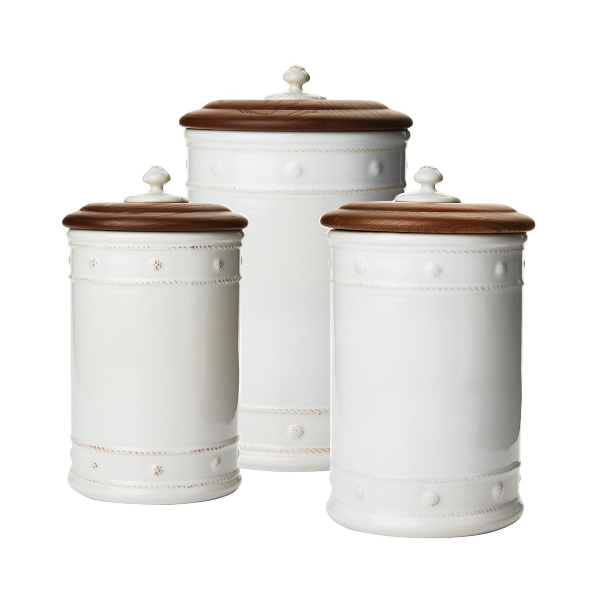 From our Berry & Thread Collection- Adorned in our rich basket weave motif and capped with an Ash Wood lid that keeps necessary supplies at your fingertips, yet under wraps. Great for your kitchen, bathroom, and office. Set includes 1) 10 inch, 1) 11 inch, and 1)13 inch canister.