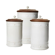 From our Berry & Thread Collection- Adorned in our rich basket weave motif and capped with an Ash Wood lid that keeps necessary supplies at your fingertips, yet under wraps. Great for your kitchen, bathroom, and office. Set includes 1) 10 inch, 1) 11 inch, and 1)13 inch canister.