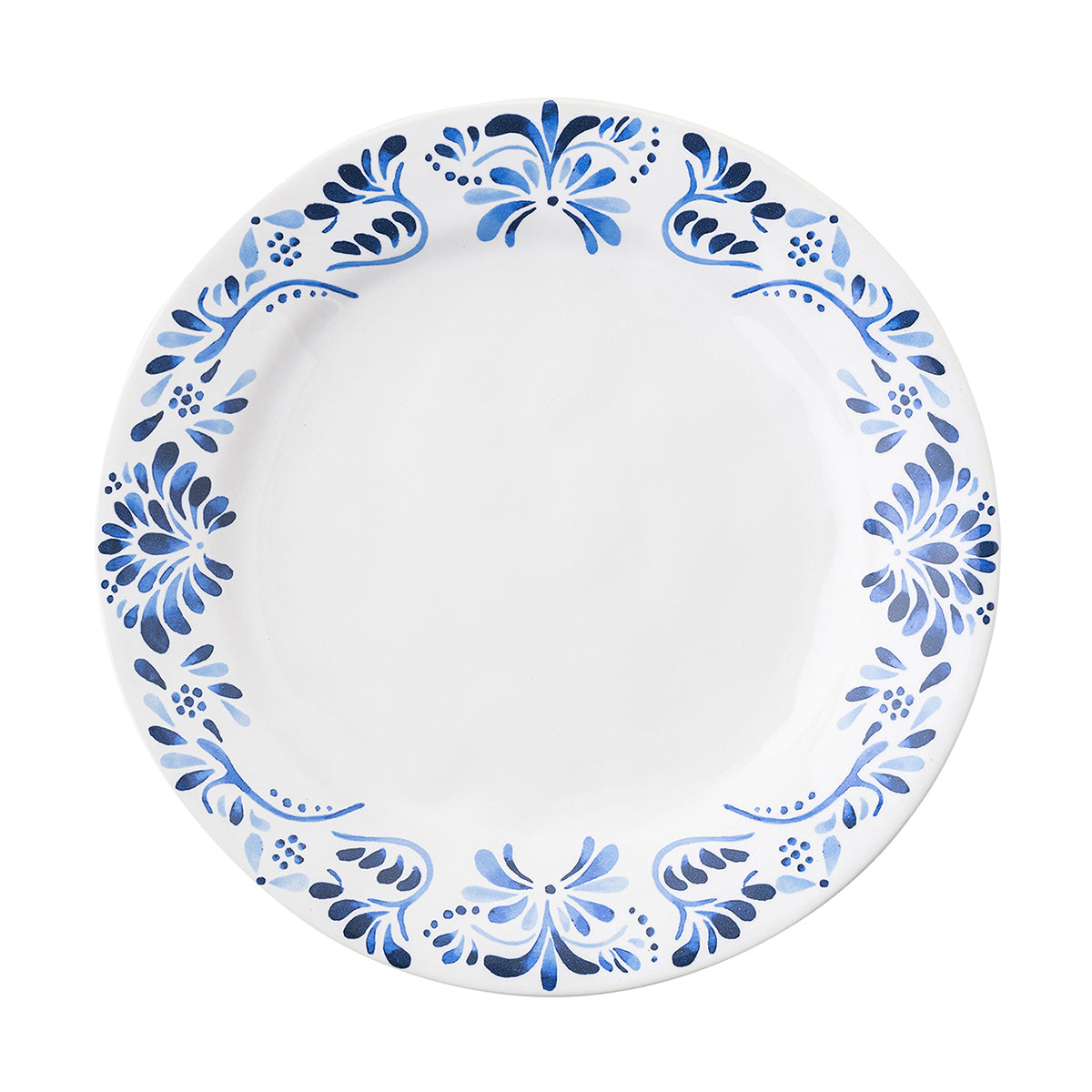 A white and blue plate with a design inspired by Iberian tiles.