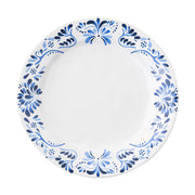 A white and blue plate with a design inspired by Iberian tiles.