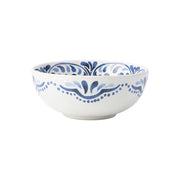 White and blue bowl with a design inspired by Iberian tiles.