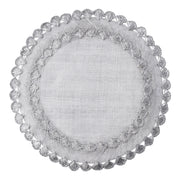 Natural woven fibers and texture are veiled in lustrous silver and embellished by a ruffled rim to create a frame for table settings that is both relaxed and elegant