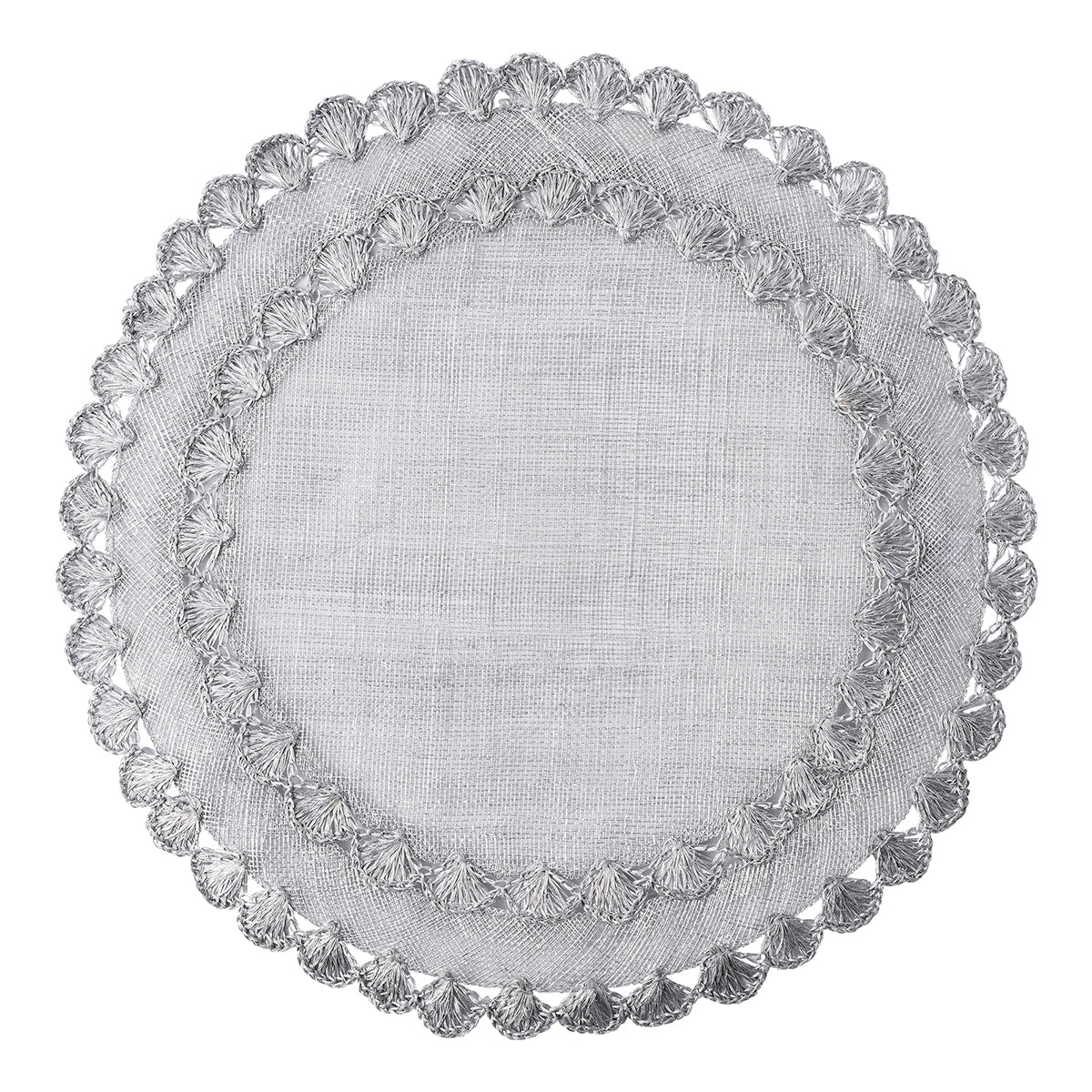 Natural woven fibers and texture are veiled in lustrous silver and embellished by a ruffled rim to create a frame for table settings that is both relaxed and elegant
