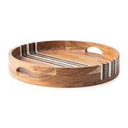 Rich layers of acacia wood and stripes of hand marbled resin are juxtaposed to create the distinct, unique look of our Stonewood Stripe collection. This round tray features two handles and vertical sides, making it perfect for serving cocktails or corralling decorative objects.