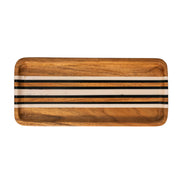 We love the intersection of natural wood grain with linear stripes in black and white that this sleek tray features. A versatile catchall for everyday life, it makes an ideal accent piece for everything from your kitchen countertop to bedside table. 