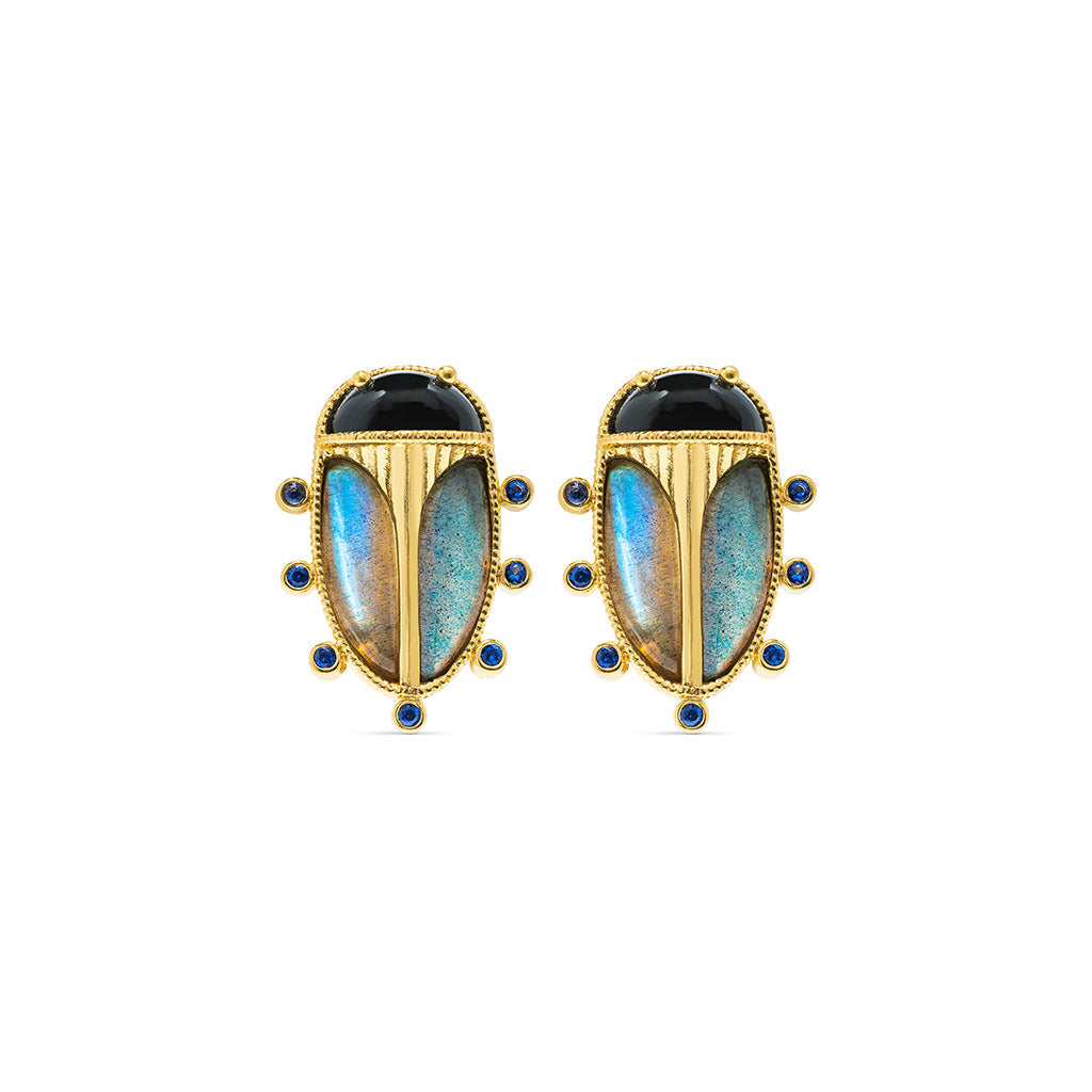 Exotic, regal and refined our stunning Scarab is an empowering talisman of renewal. The wings are rendered in luminescent, hand-carved and polished blue labradorite shell, a black agate is set for the head and 18K flash gold plated brass on radiant gold clip.