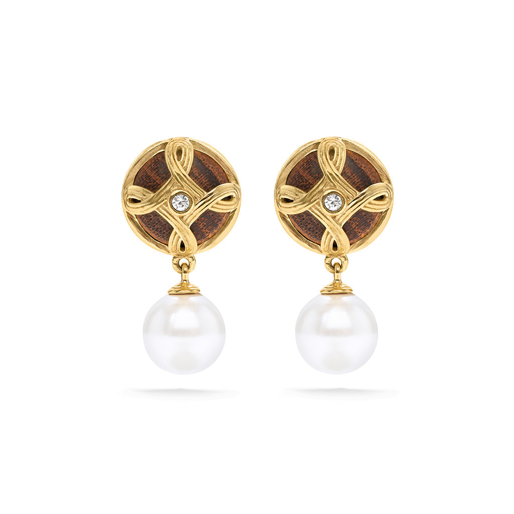 Effortlessly chic, these perfectly proportioned earrings of hand-carved teak wood and pearls with a tiny crystal center, look perfect with practically everything. These are a great go-to earring for the jet-setting woman. 