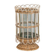 Aglow with flickering candlelight or filled with flowers as a vase, this intricately hand-woven rattan hurricane is rustic, refined, and romantic. Lovely for illuminating cozy corners, hidden terraces, and twilight garden parties. 