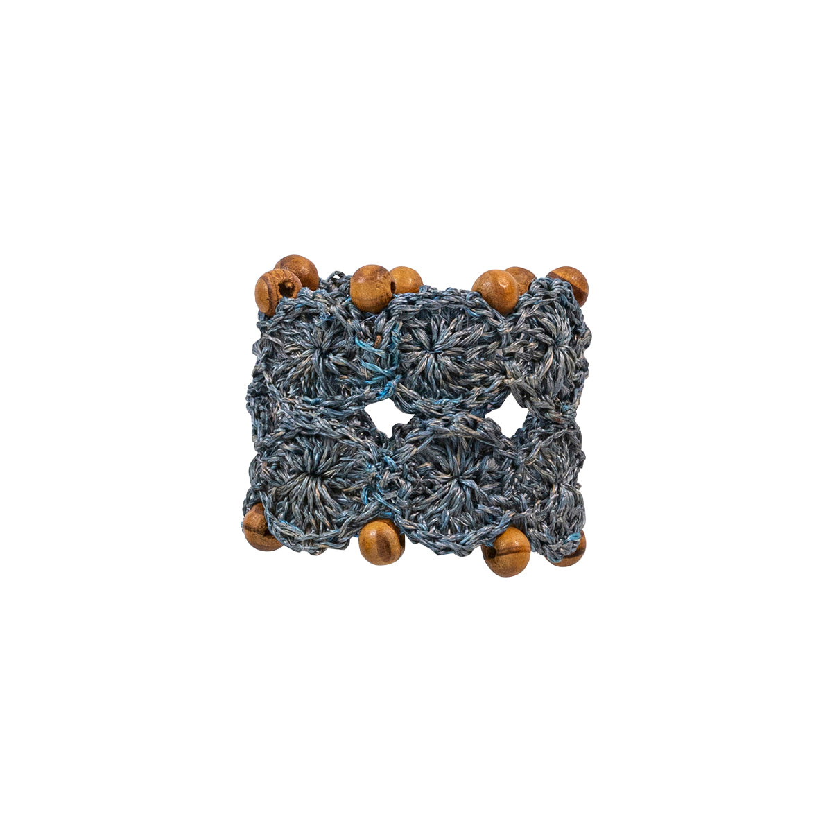 These hand-crafted napkin rings are made of intricately woven Abaca fibers in chambray blue and embellished with wooden beads for a look that is naturally textural, casual, and a bit bohemian - yet when encircling a lovely linen napkin - undeniably put-together and chic. 